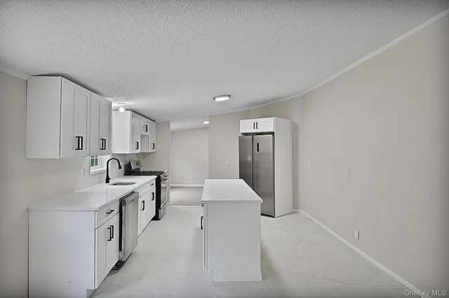 a spacious bathroom with a double vanity sink and a mirror