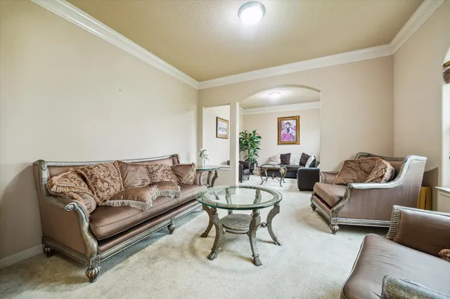 a bathroom with a sink a toilet a mirror and shower curtain