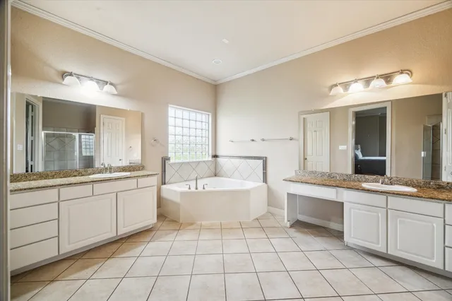 a bedroom with a bed couch and window