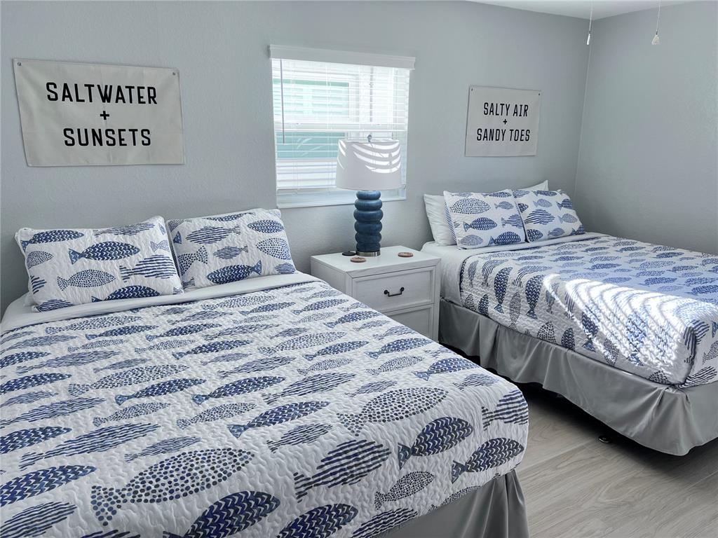 6154 Midnight Pass Road, Unit A11 Sarasota, FL 34242 - Photo 16 of 22 a bedroom with double bed and a window