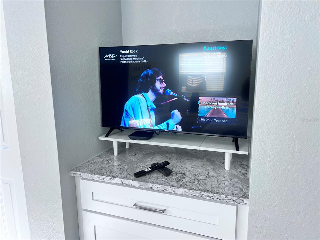 6154 Midnight Pass Road, Unit A11 Sarasota, FL 34242 - Photo 19 of 22 a bathroom with a granite countertop sink and a mirror