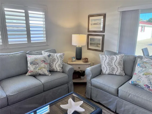 a living room with furniture and a window