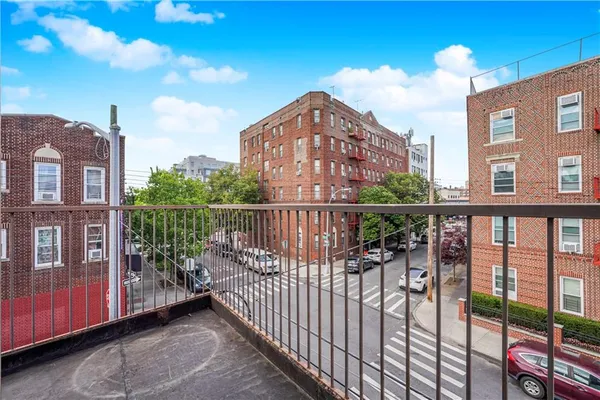 a view of a brick building from a balcony