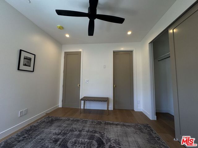 a view of a livingroom with furniture and a window
