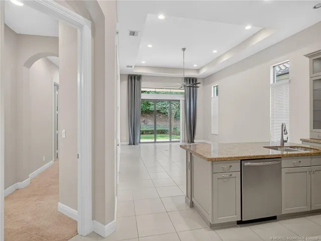 an empty room with closet and ceiling fan