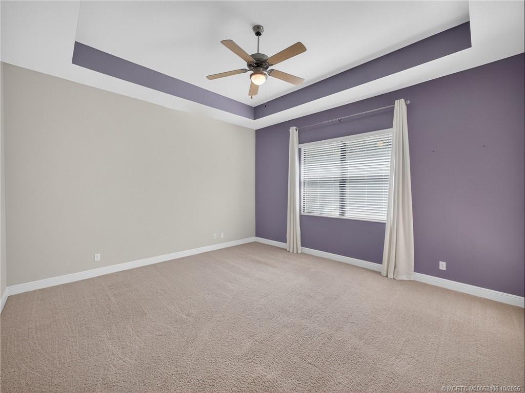 600 Southeast Fascino Circle Port St. Lucie, FL 34984 - Photo 13 of 22 an empty room with closet and ceiling fan