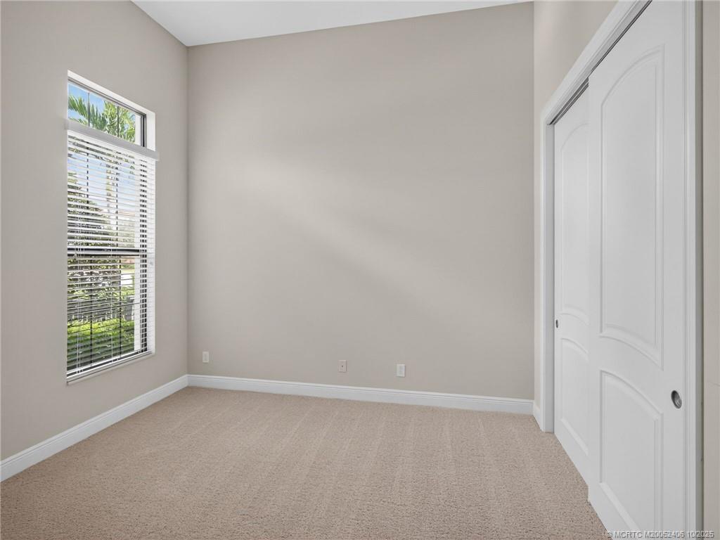 600 Southeast Fascino Circle Port St. Lucie, FL 34984 - Photo 17 of 22 an empty room with windows