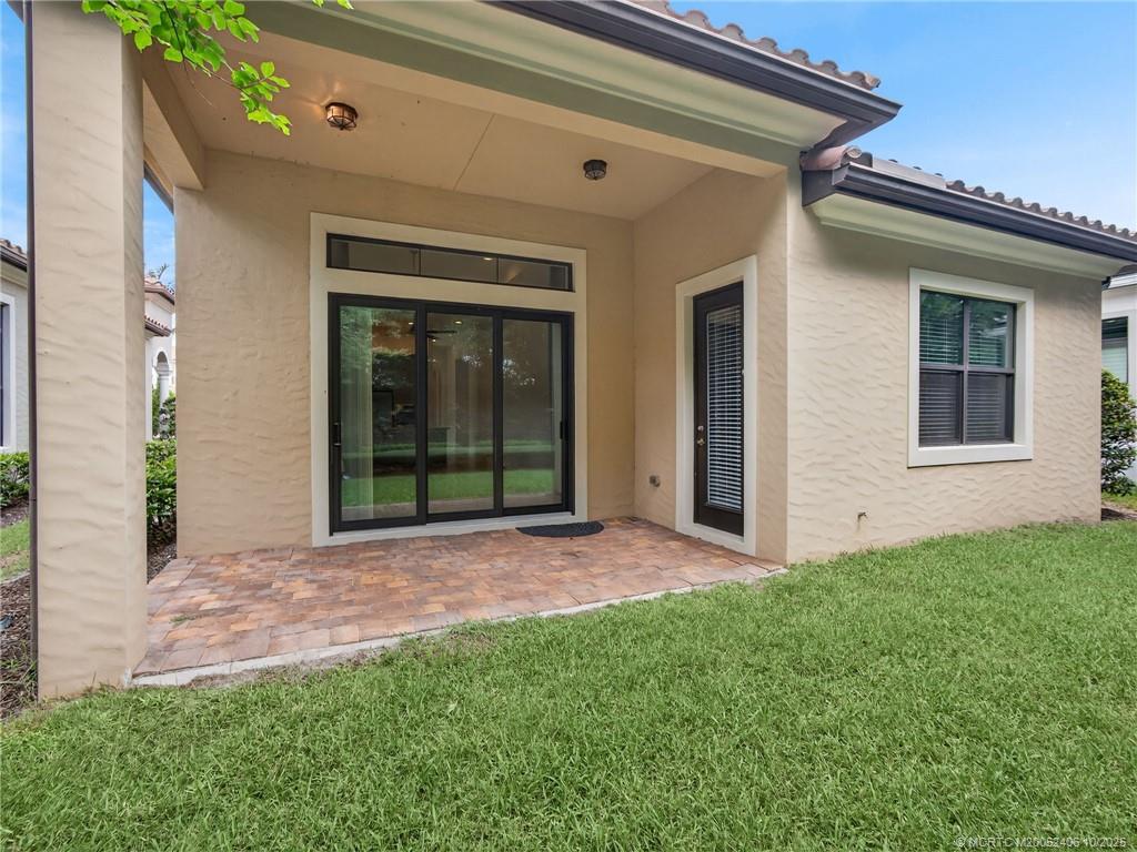 600 Southeast Fascino Circle Port St. Lucie, FL 34984 - Photo 20 of 22 front view of a house with a yard