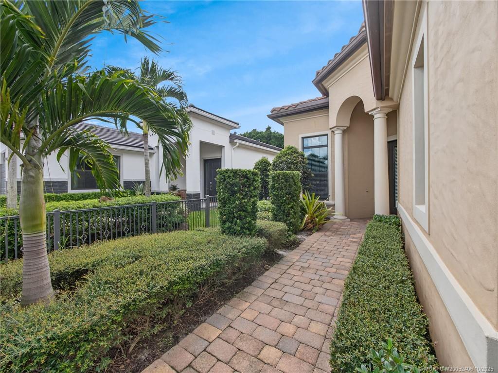 600 Southeast Fascino Circle Port St. Lucie, FL 34984 - Photo 2 of 22 a view of a garden with pathway