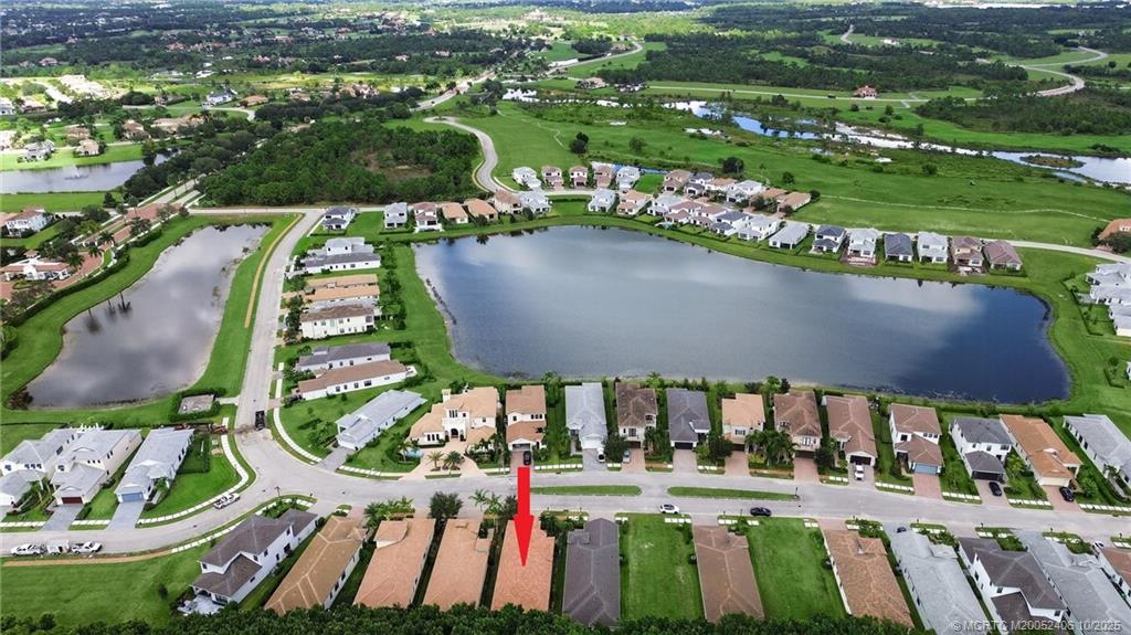 600 Southeast Fascino Circle Port St. Lucie, FL 34984 - Photo 3 of 22 an aerial view of residential houses with outdoor space and street view