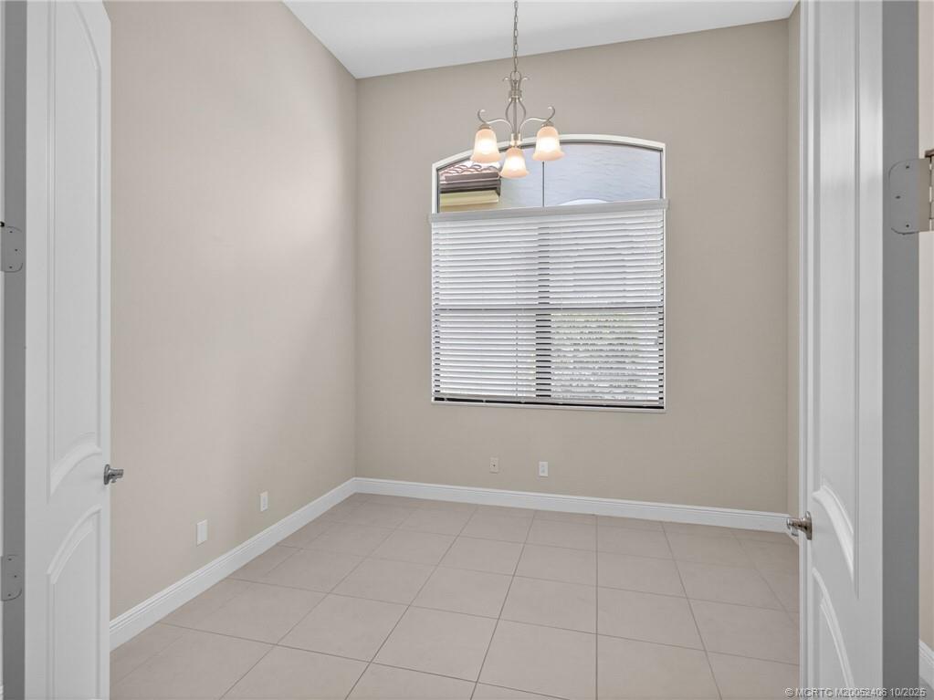 600 Southeast Fascino Circle Port St. Lucie, FL 34984 - Photo 5 of 22 an empty room with chandelier fan
