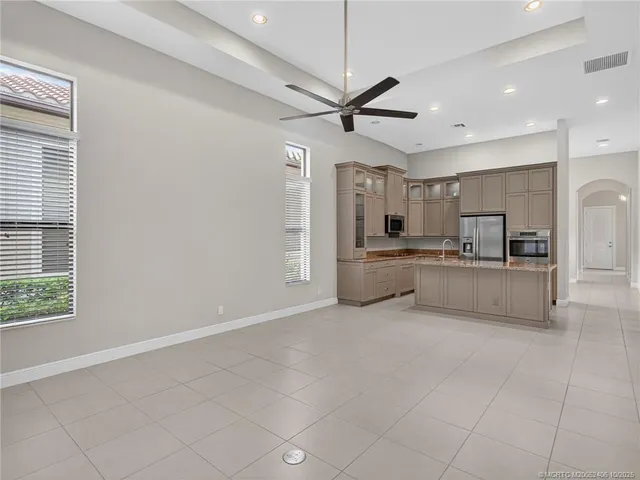 a view of a kitchen with a sink and cabinets