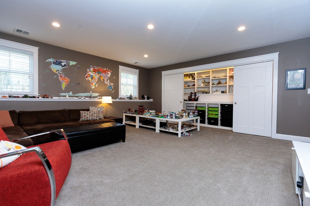 74 Hillcrest Road Needham, MA 02492 - Photo 25 of 29 a room with furniture and a flat screen tv