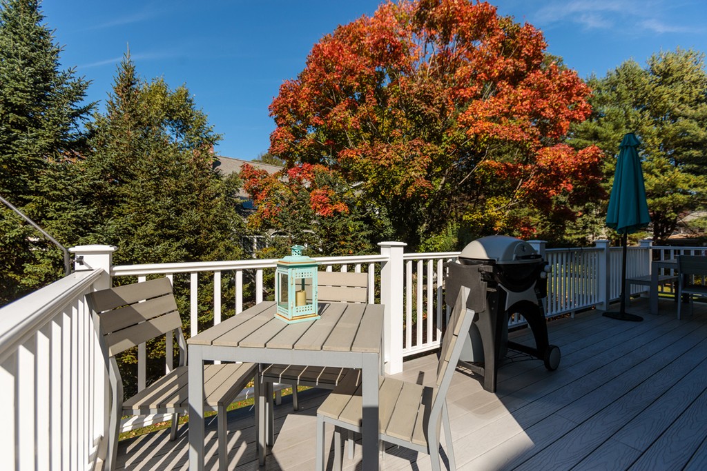 74 Hillcrest Road Needham, MA 02492 - Photo 28 of 29 a balcony with wooden floor table and chairs