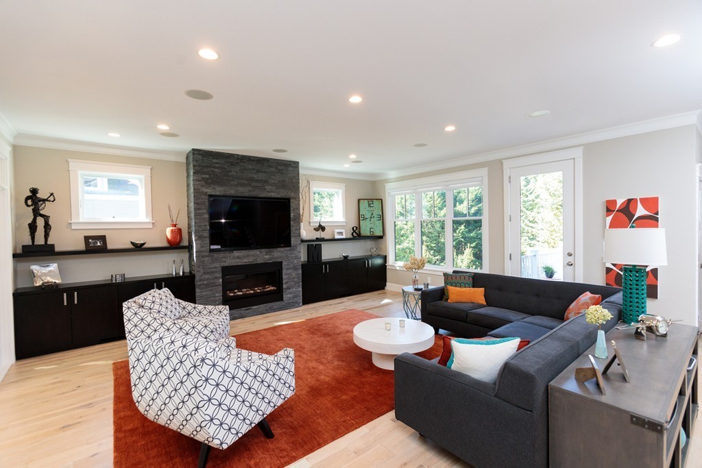 74 Hillcrest Road Needham, MA 02492 - Photo 6 of 29 a living room with furniture fireplace and a large window
