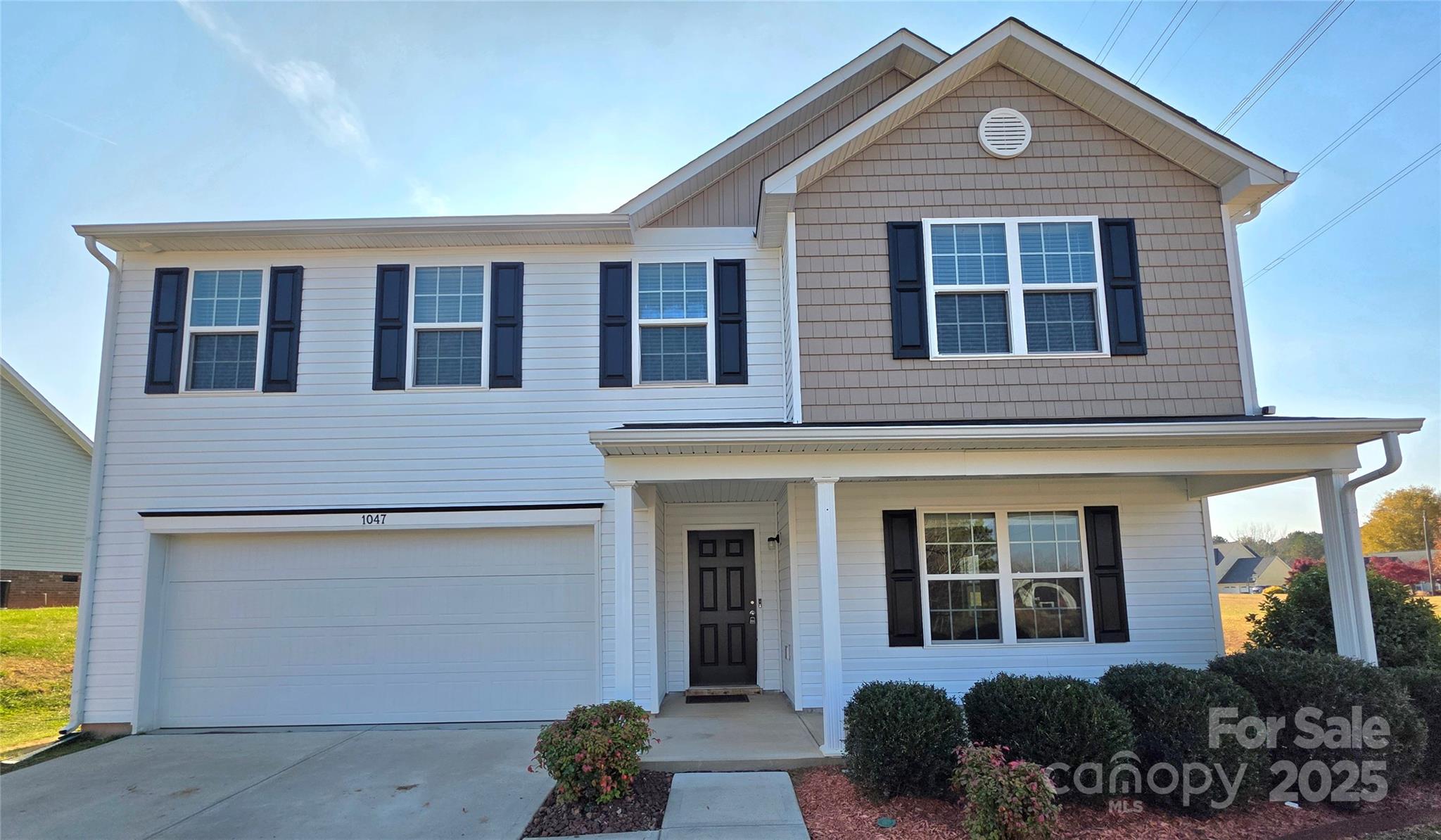 1047 Mackey Court Gastonia, NC 28056 - Photo 1 of 30 a front view of a house with a yard