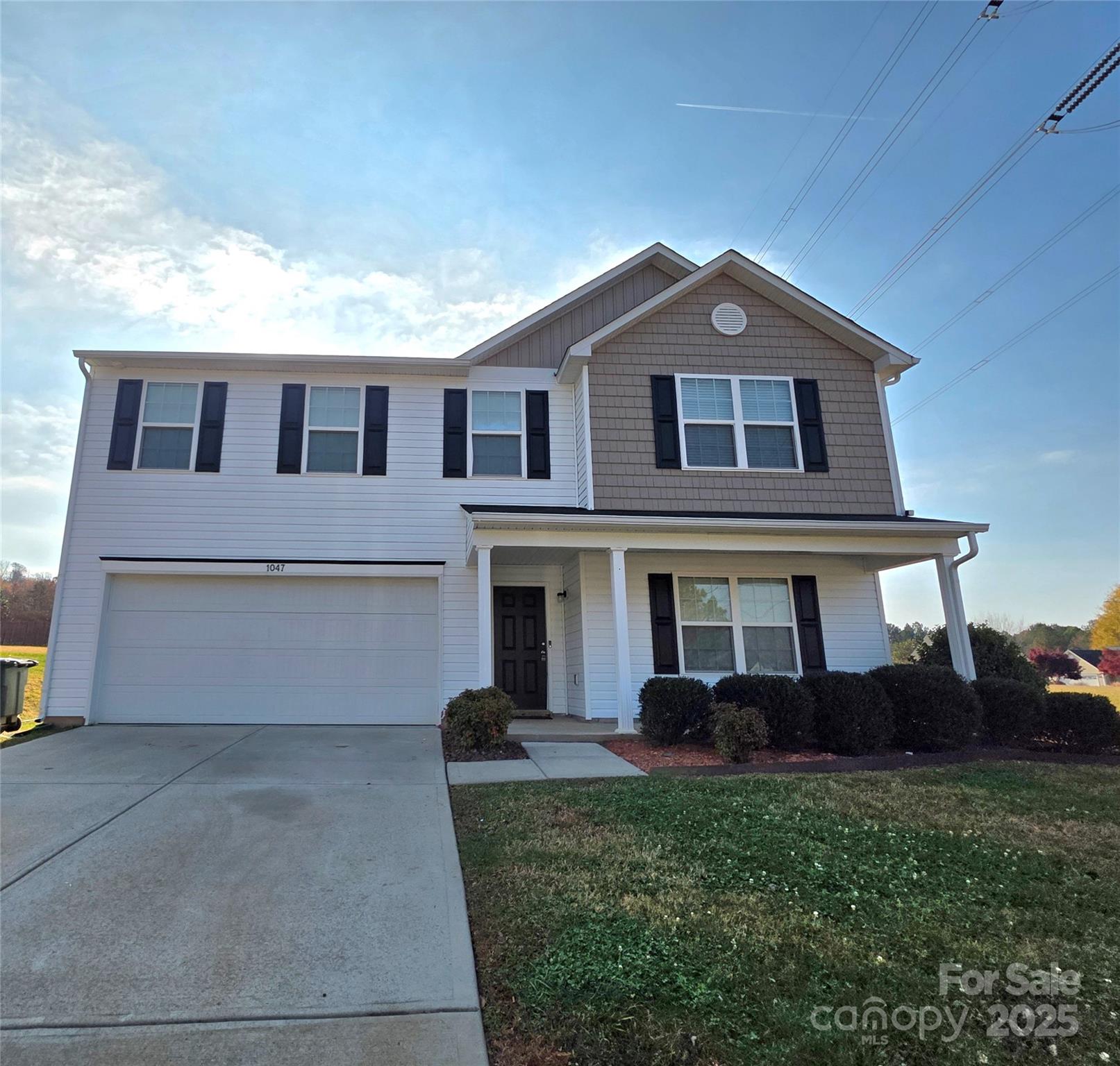 1047 Mackey Court Gastonia, NC 28056 - Photo 2 of 30 a front view of a house with a yard