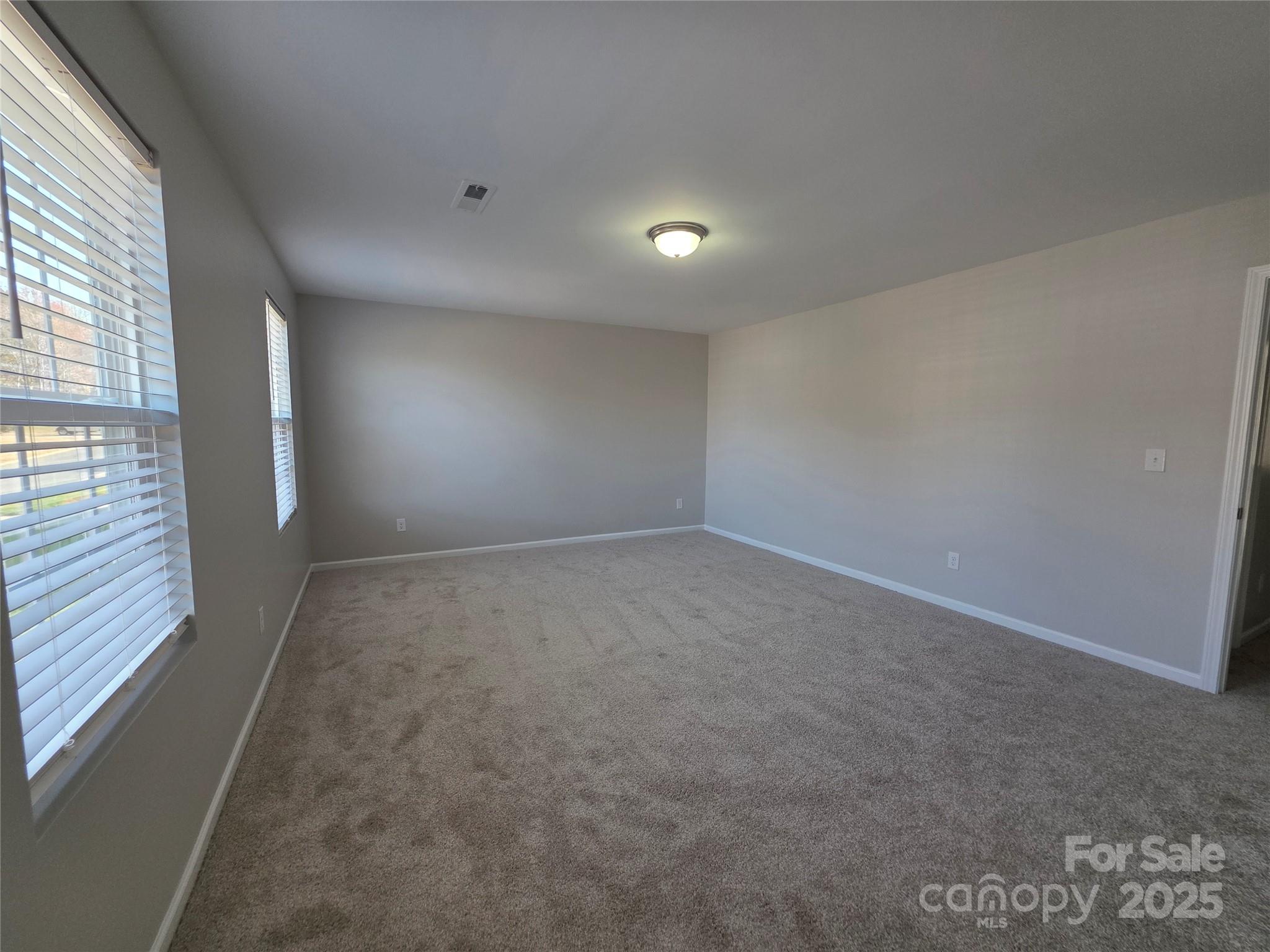 1047 Mackey Court Gastonia, NC 28056 - Photo 21 of 30 an empty room with windows and entrance