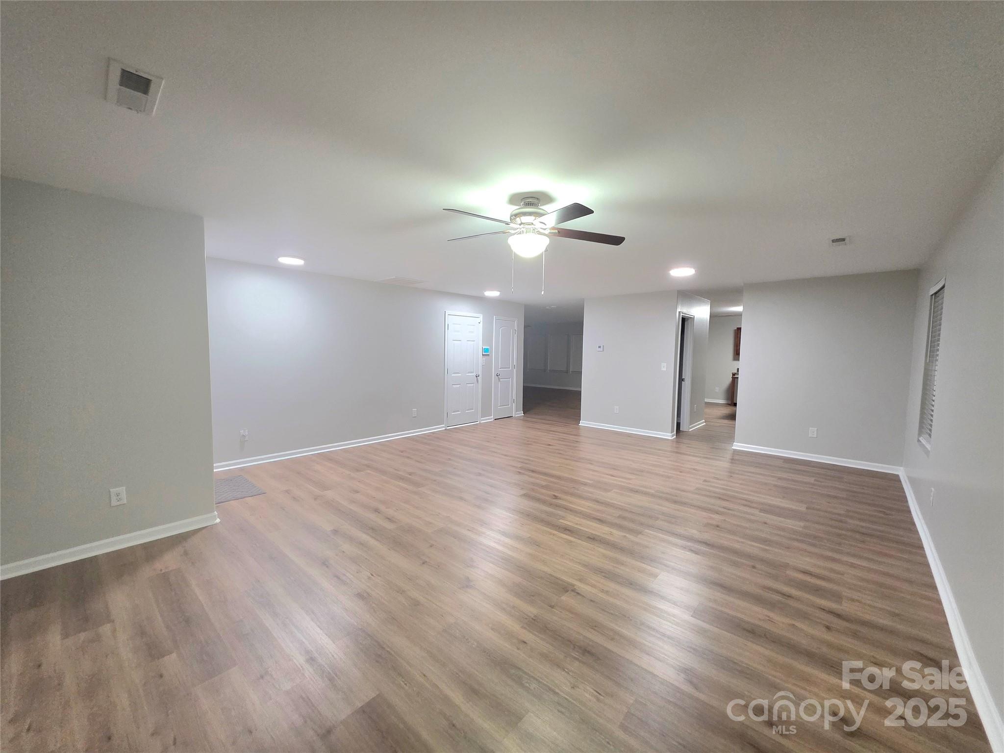 1047 Mackey Court Gastonia, NC 28056 - Photo 30 of 30 a view of an empty room with wooden floor