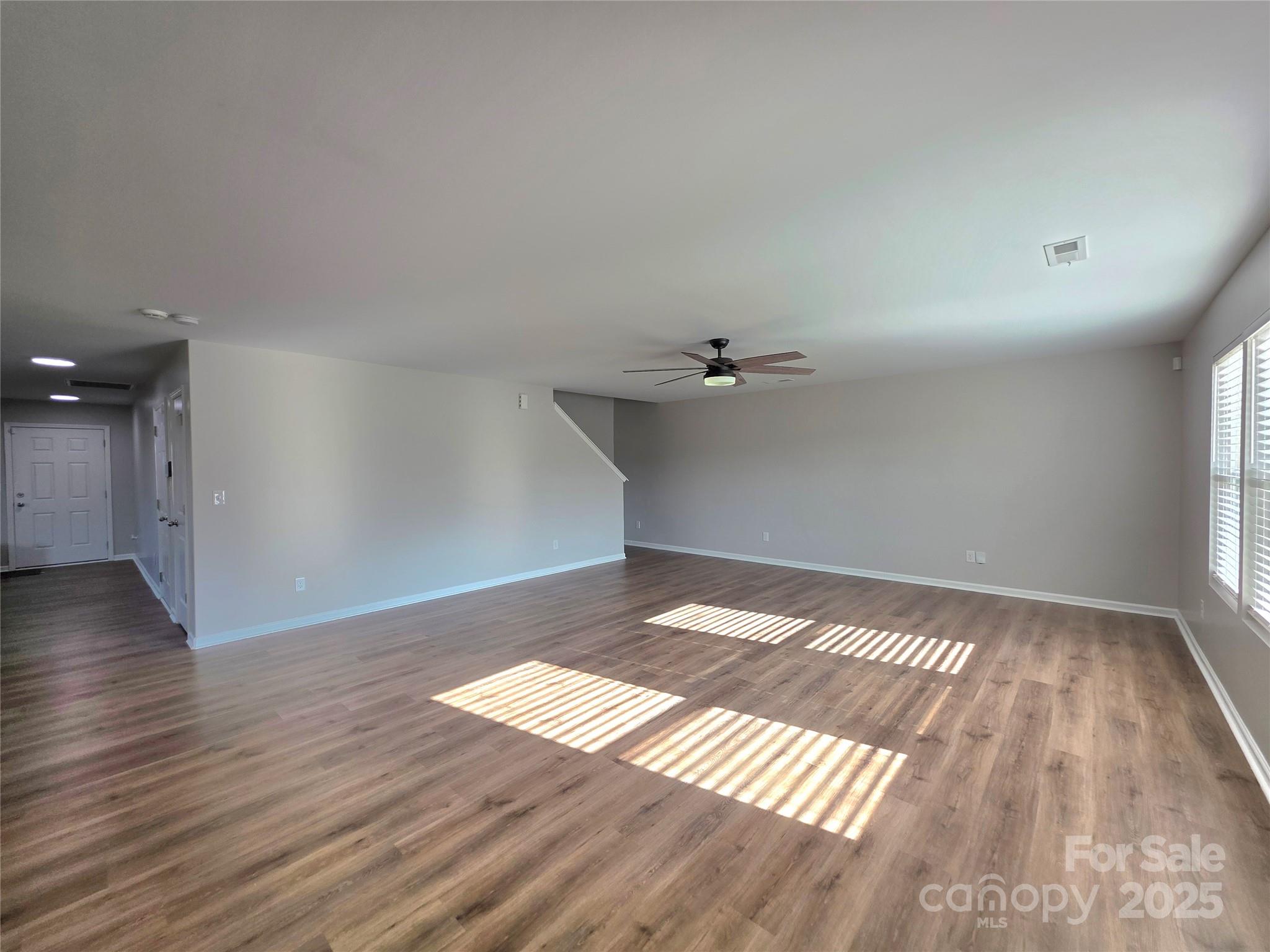 1047 Mackey Court Gastonia, NC 28056 - Photo 4 of 30 a view of an empty room and wooden floor