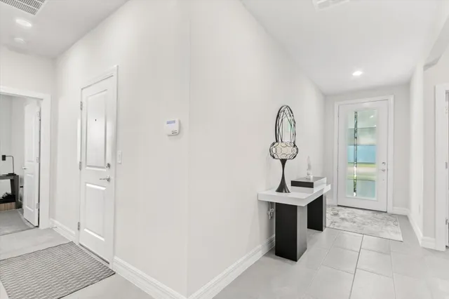 a room with a table and a mirror