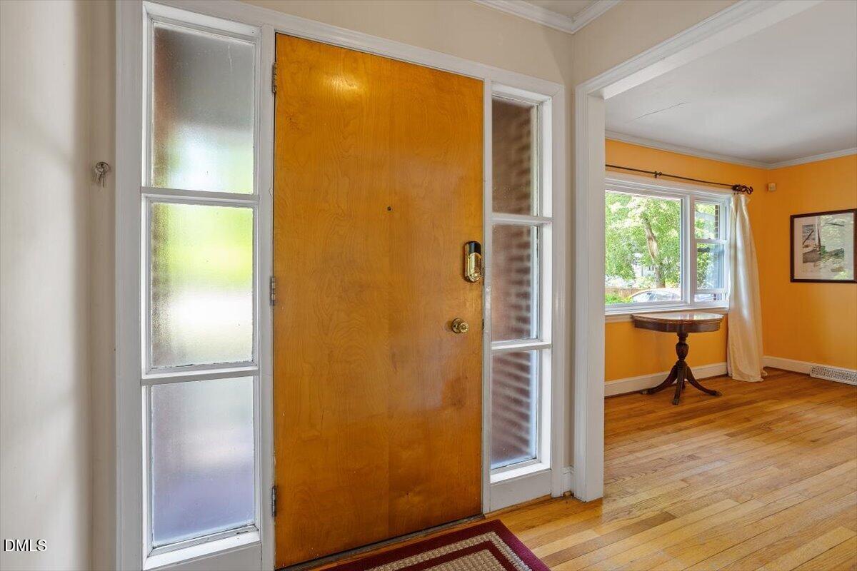 3107 Dixon Road Durham, NC 27707 - Photo 2 of 35 a view of an empty room with a window and wooden floor
