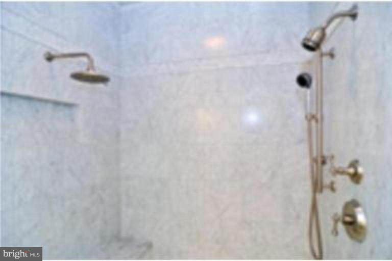 7816 Maple Ridge Road Bethesda, MD 20814 - Photo 11 of 16 a bathroom with a shower