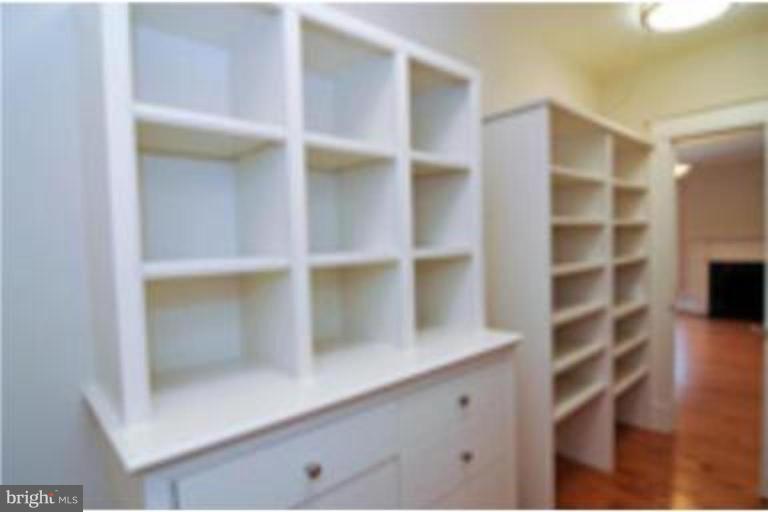 7816 Maple Ridge Road Bethesda, MD 20814 - Photo 13 of 16 a view of walk in closet with empty racks