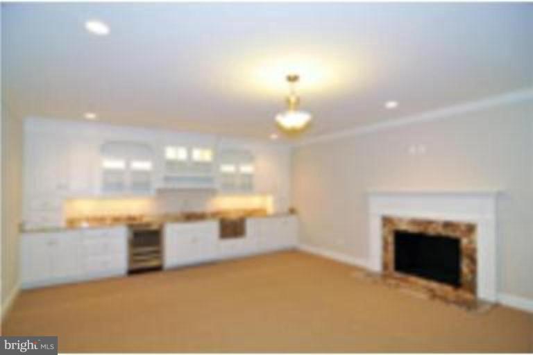 7816 Maple Ridge Road Bethesda, MD 20814 - Photo 16 of 16 a view of empty room with a fireplace
