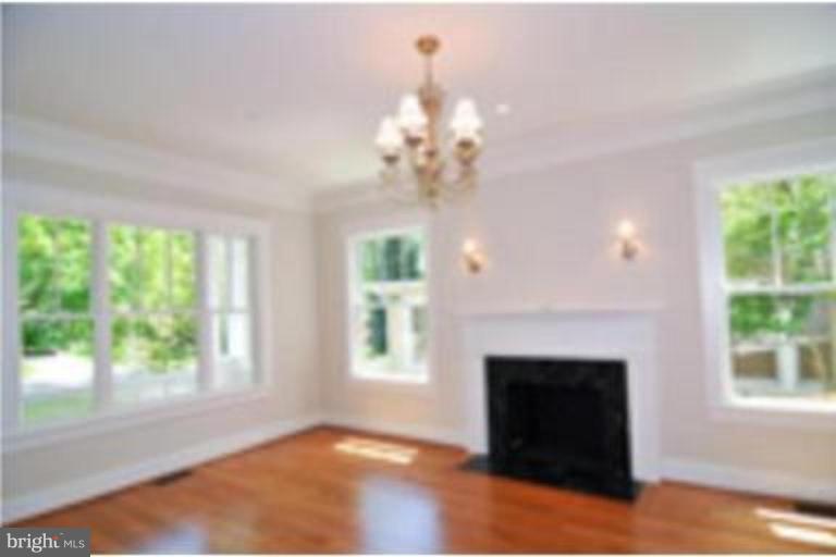 7816 Maple Ridge Road Bethesda, MD 20814 - Photo 3 of 16 a view of a livingroom with a fireplace window and outside view