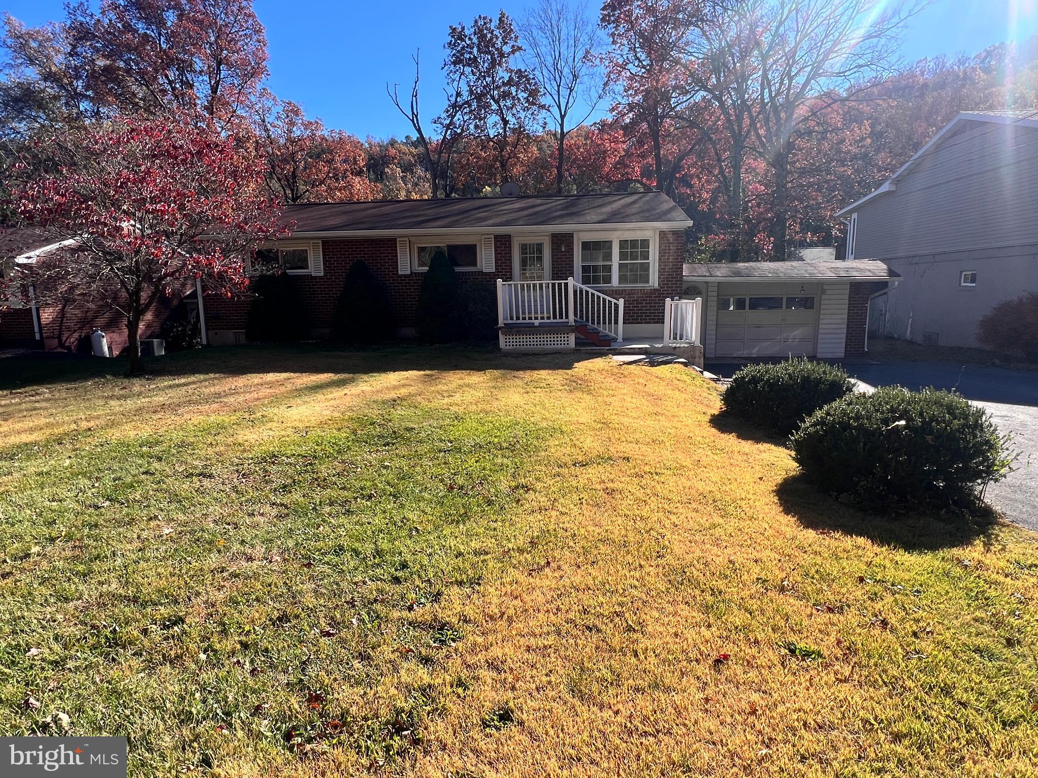 a view of a house with a yard