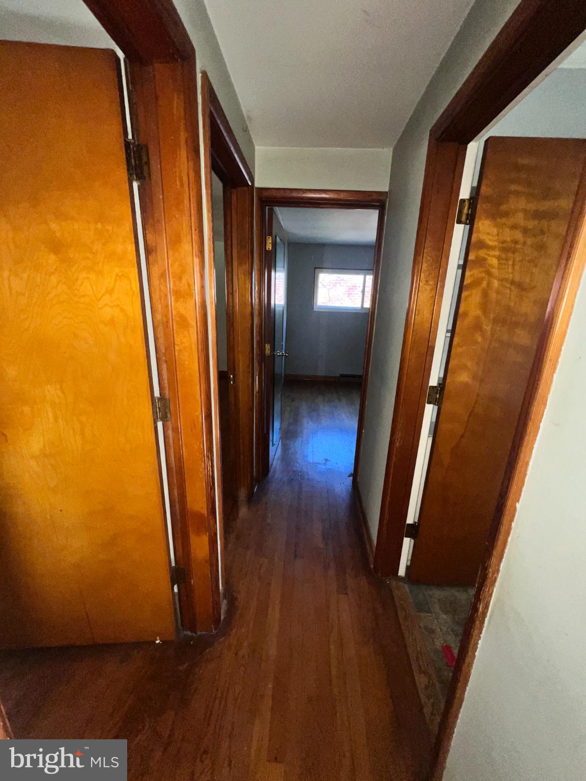 1074 Braddock Road Cumberland, MD 21502 - Photo 13 of 38 Inviting hallway with warm wooden accents.