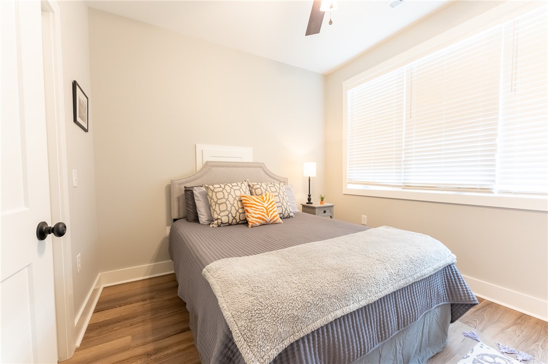 103 Riggs Drive Clemson, SC 29631 - Photo 41 of 50 Well-lit sleeping quarters with rich hardwood flooring and a stylish ceiling fan for comfort.