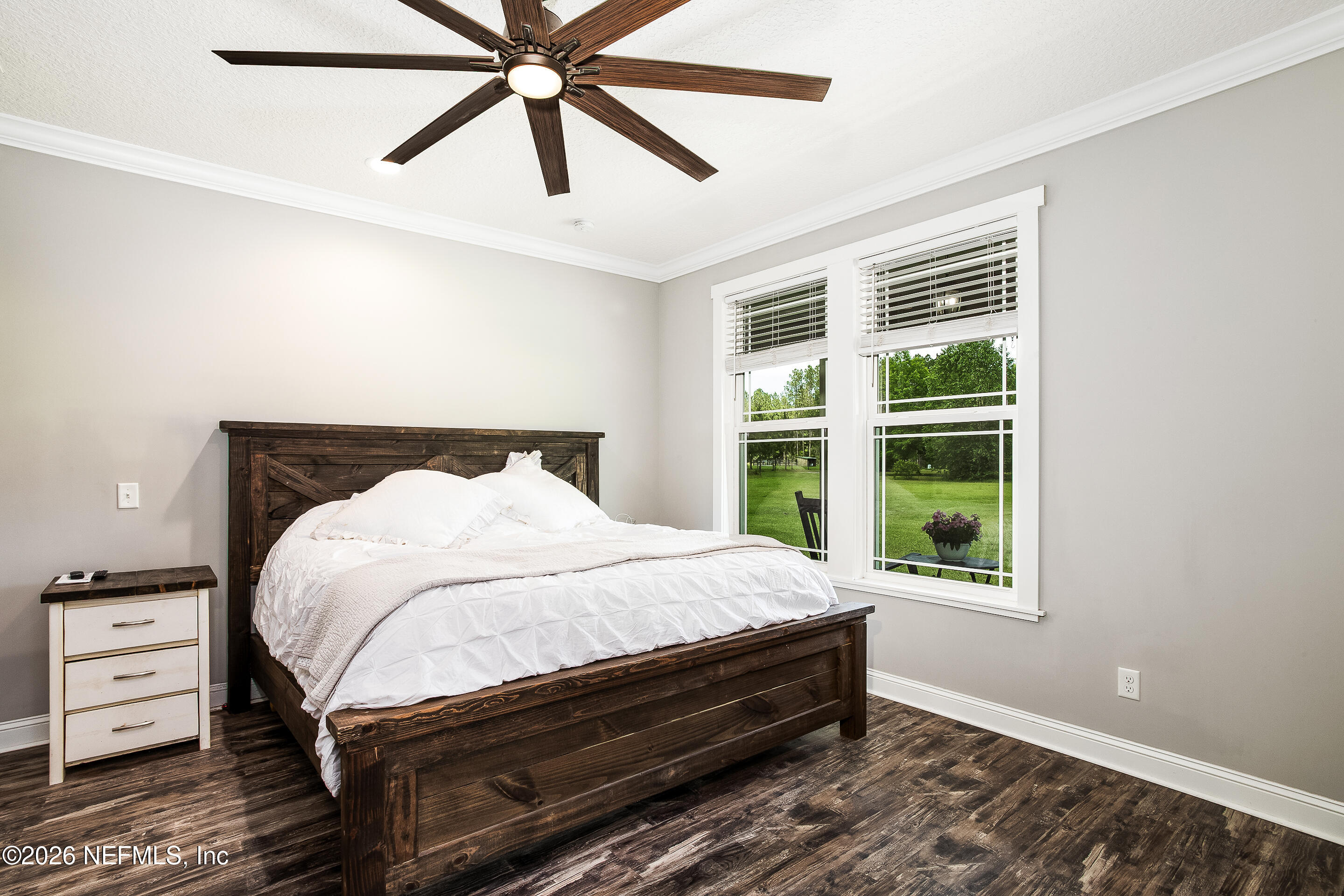 26575 Sheared Stokes Road Hilliard, FL 32046 - Photo 14 of 39 a bedroom with a bed and a window