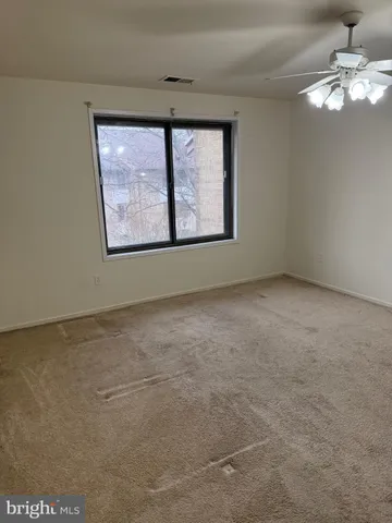 a view of an empty room with a window