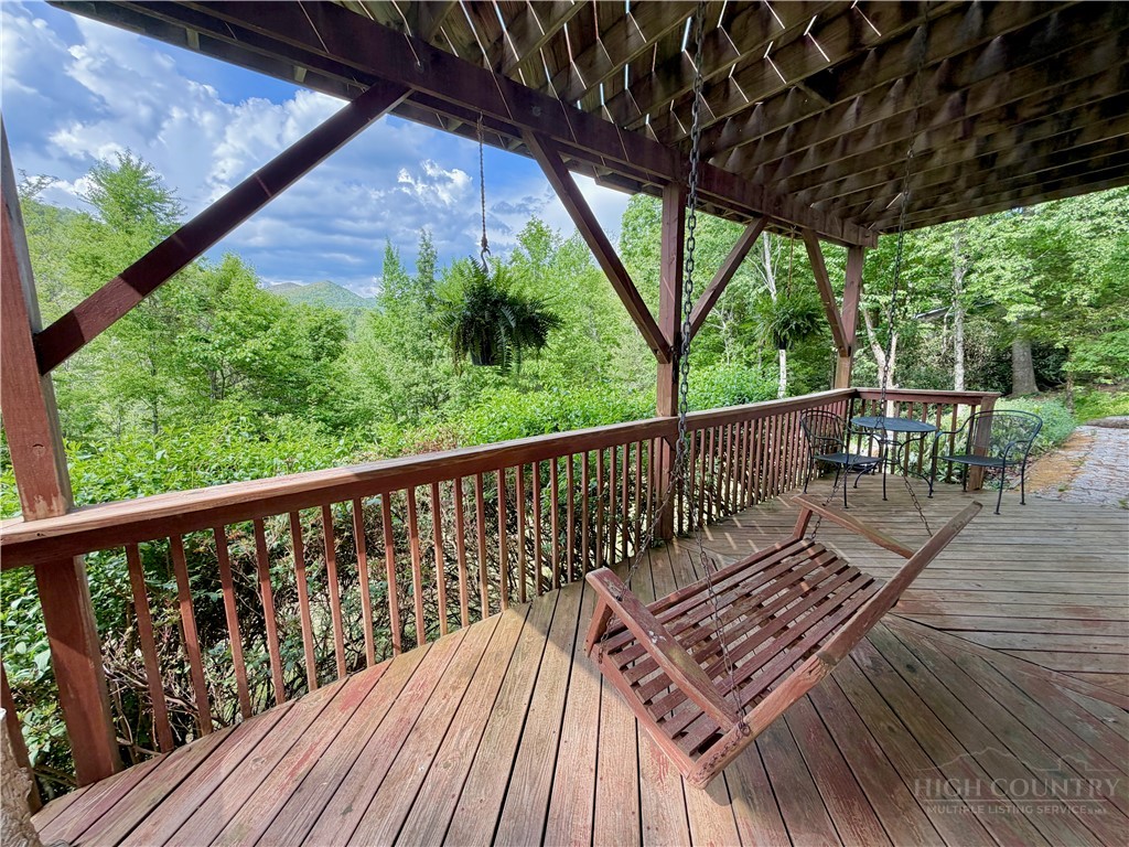 1173 Hopewell Church Road Boone, NC 28607 - Photo 32 of 39 a balcony with wooden floor in outdoor space