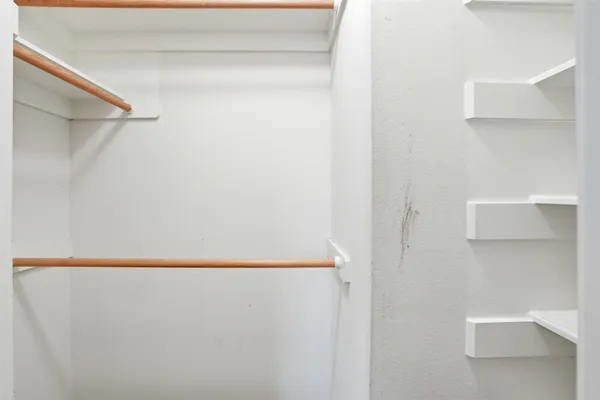 a bathroom with a double vanity sink toilet and shower