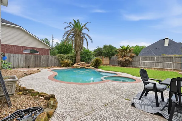 a view of a swimming pool with an outdoor space