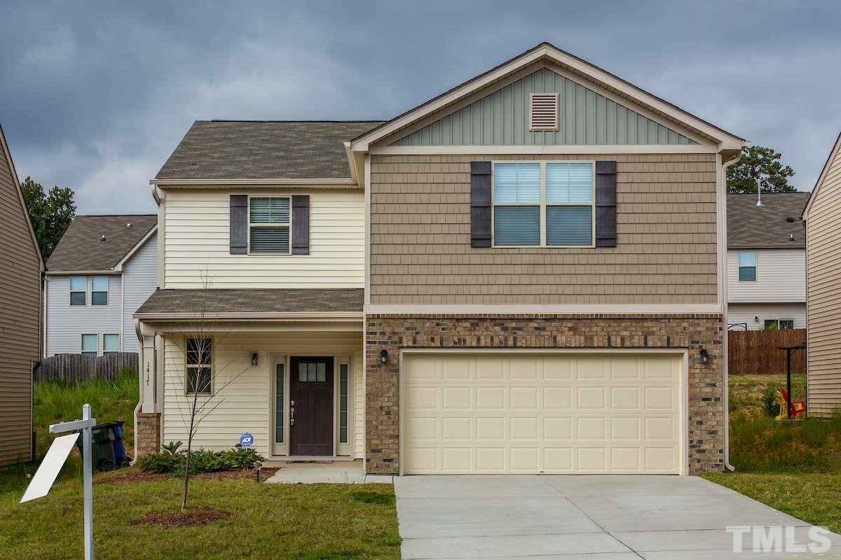 1417 Lombar Street Raleigh, NC 27610 - Photo 1 of 19 a front view of a house with garden