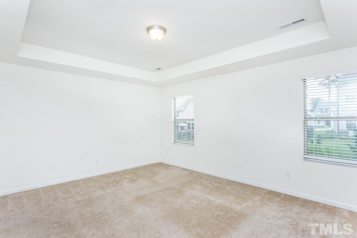 1417 Lombar Street Raleigh, NC 27610 - Photo 13 of 19 an empty room with windows