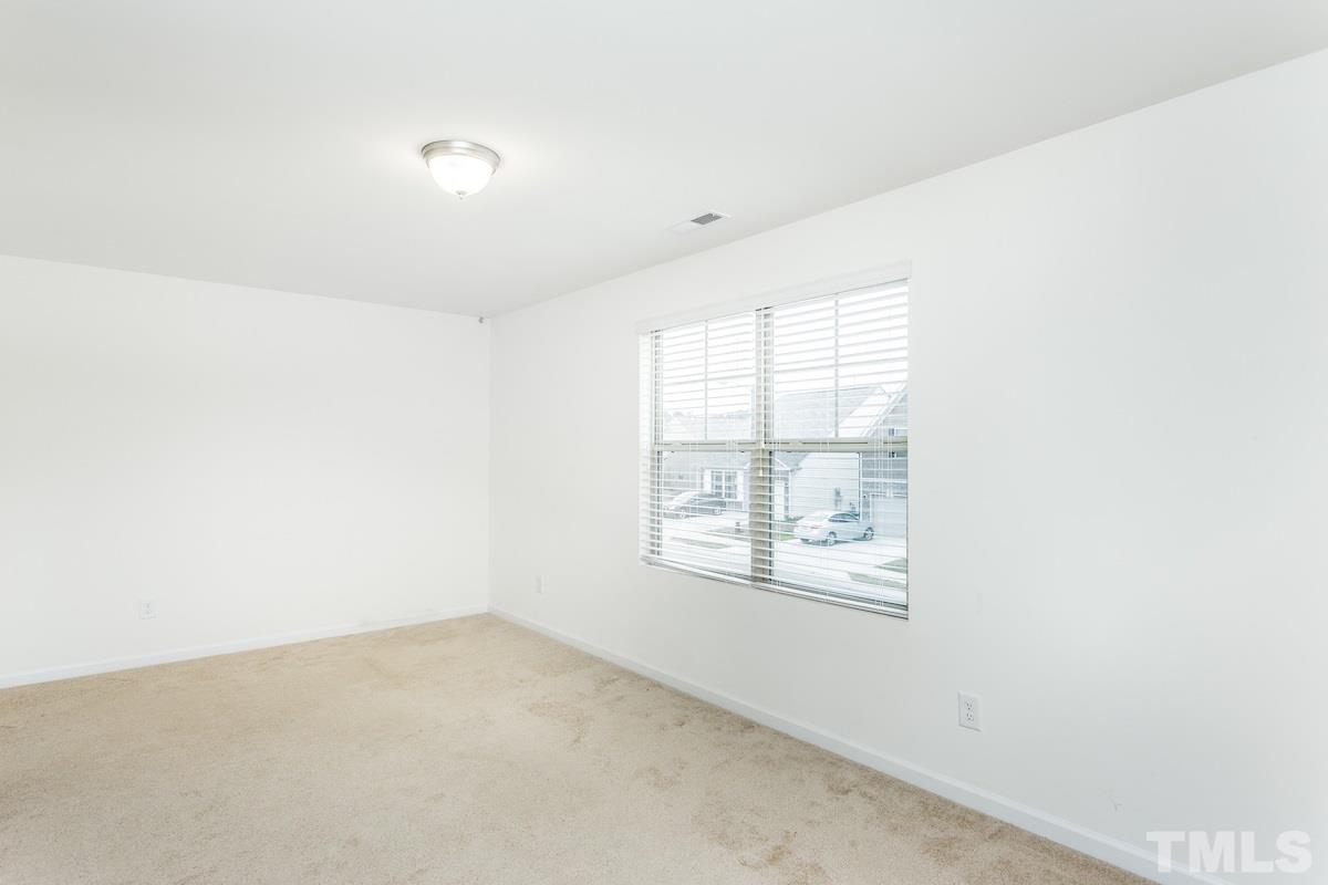 1417 Lombar Street Raleigh, NC 27610 - Photo 15 of 19 an empty room with windows