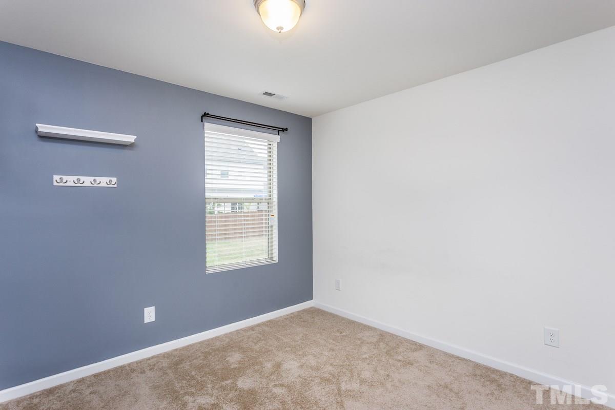 1417 Lombar Street Raleigh, NC 27610 - Photo 18 of 19 an empty room with windows