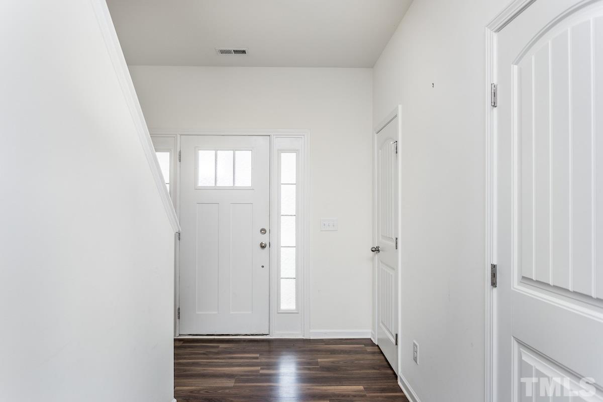 1417 Lombar Street Raleigh, NC 27610 - Photo 4 of 19 a view of a hallway with wooden floor