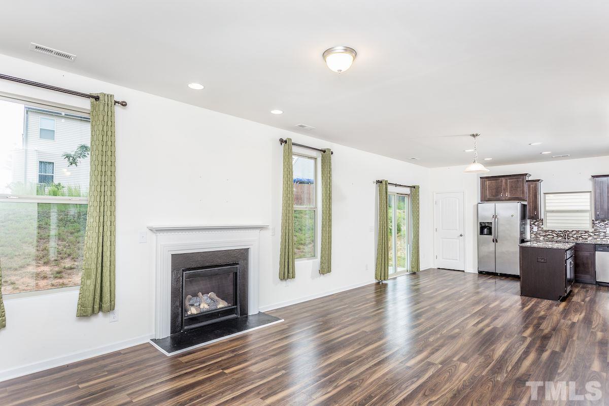 1417 Lombar Street Raleigh, NC 27610 - Photo 7 of 19 a view of a living room with furniture and a fireplace