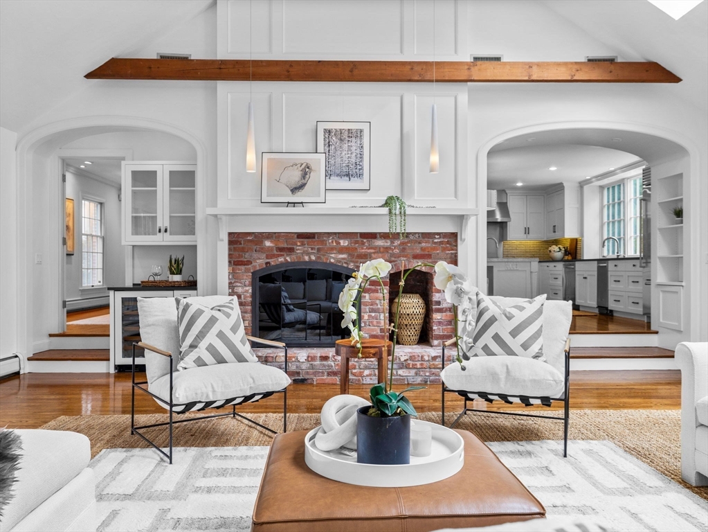 10 Livingston Road Wellesley, MA 02482 - Photo 12 of 36 a living room with furniture a dining table and a fireplace