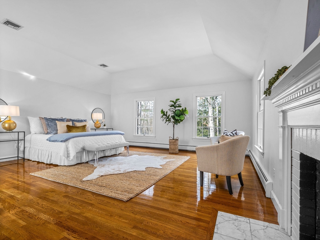 10 Livingston Road Wellesley, MA 02482 - Photo 18 of 36 a bedroom with furniture and a wooden floor
