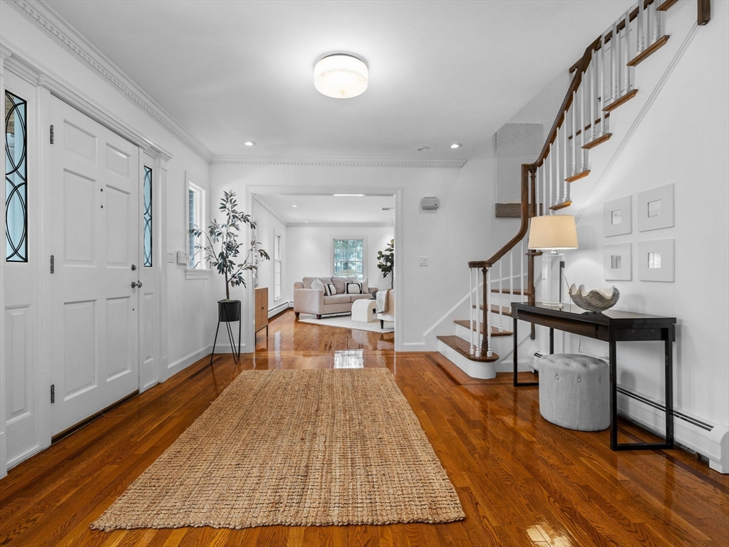 10 Livingston Road Wellesley, MA 02482 - Photo 2 of 36 a living room with furniture and a wooden floor
