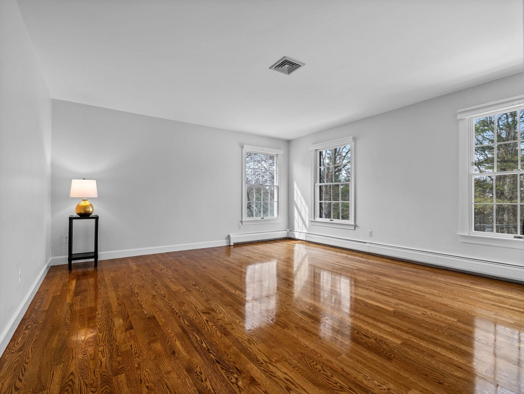 10 Livingston Road Wellesley, MA 02482 - Photo 23 of 36 a view of an empty room with wooden floor and a window