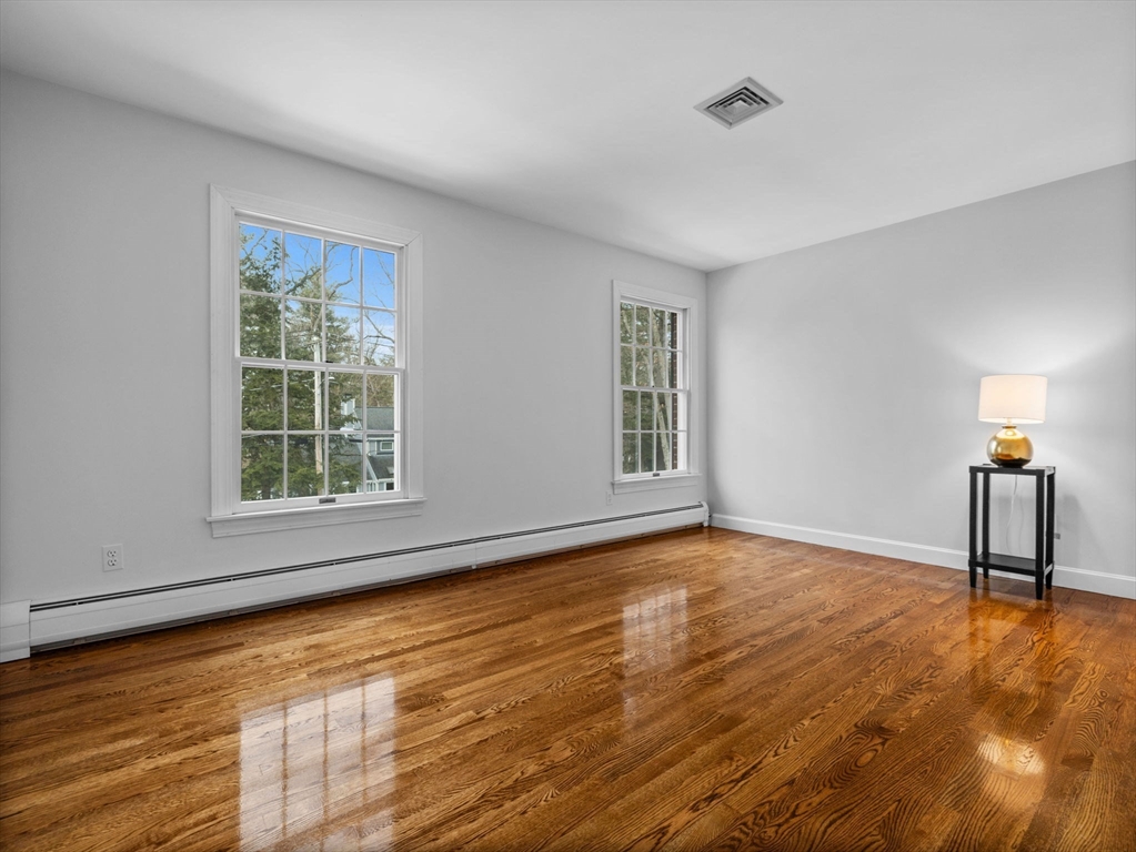 10 Livingston Road Wellesley, MA 02482 - Photo 24 of 36 a view of empty room with wooden floor and fan