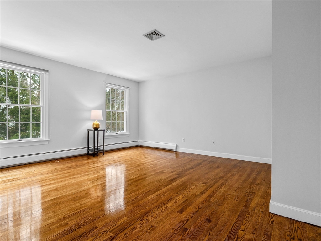 10 Livingston Road Wellesley, MA 02482 - Photo 26 of 36 an empty room with wooden floor and windows